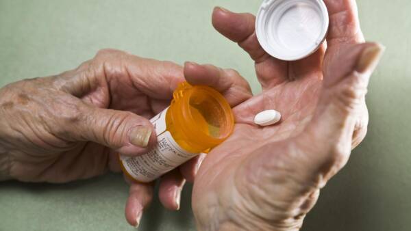 hands dispensing medication